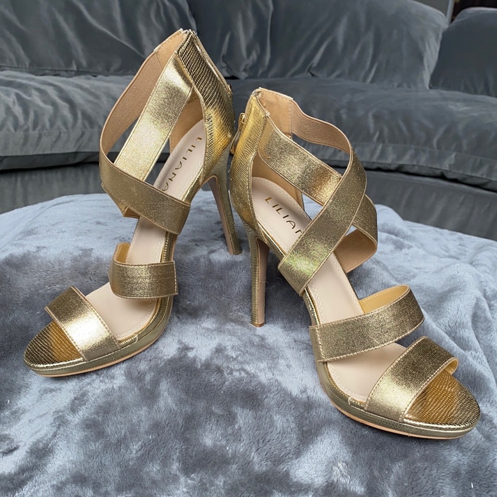 NWOT gold high heel sandal Zip up heel. Never worn